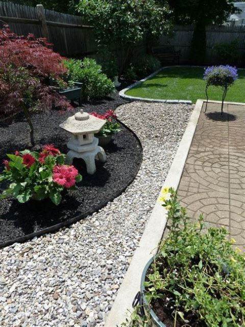 black and white pebbles, bold blooms, shrubs and mini maples for an elegant Japanese front yard